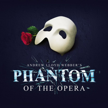 The poster for The Phantom of the Opera, including the Phantom’s white mask, a red rose, and the title of the show beneath, where the word Phantom resembles glass shattering.